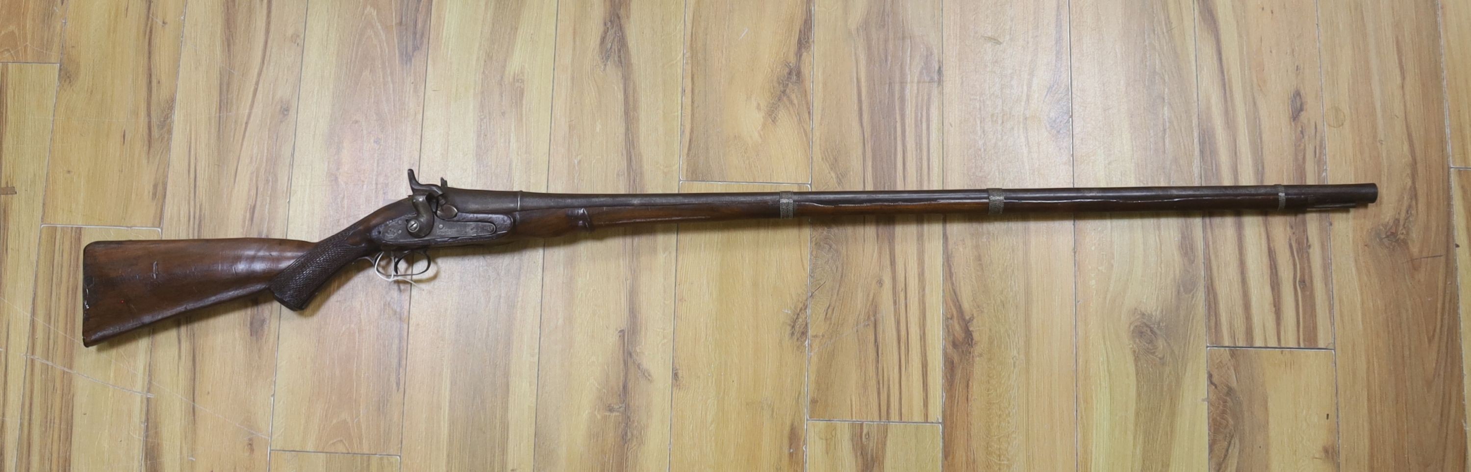 A 19th century percussion musket with walnut stock and ramrod, 158cm